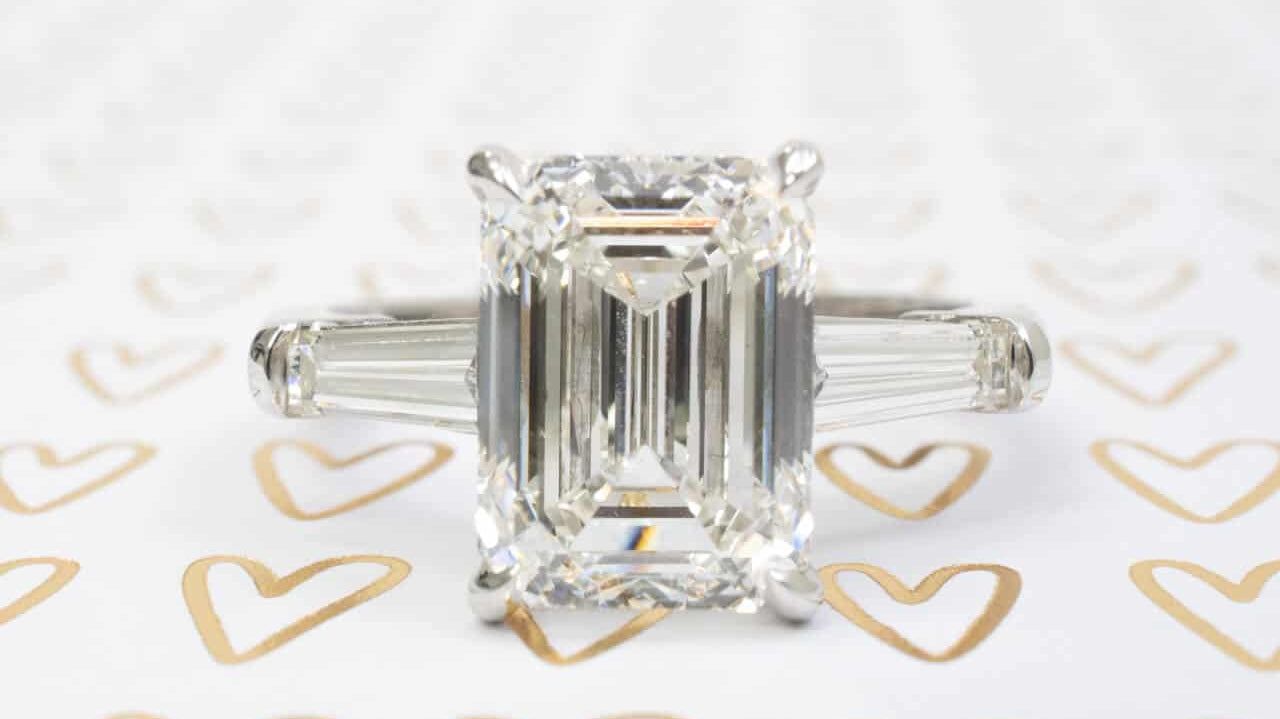 three stone emerald cut engagement ring