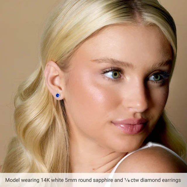 Model wearing blue sapphire stud earrings