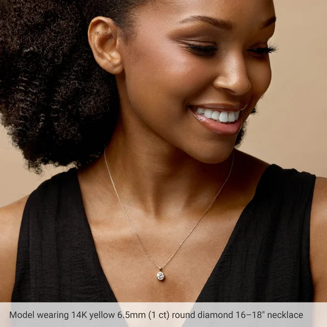 Model wearing a 14K Gold Natural Diamond Bezel-Set Solitaire Necklace