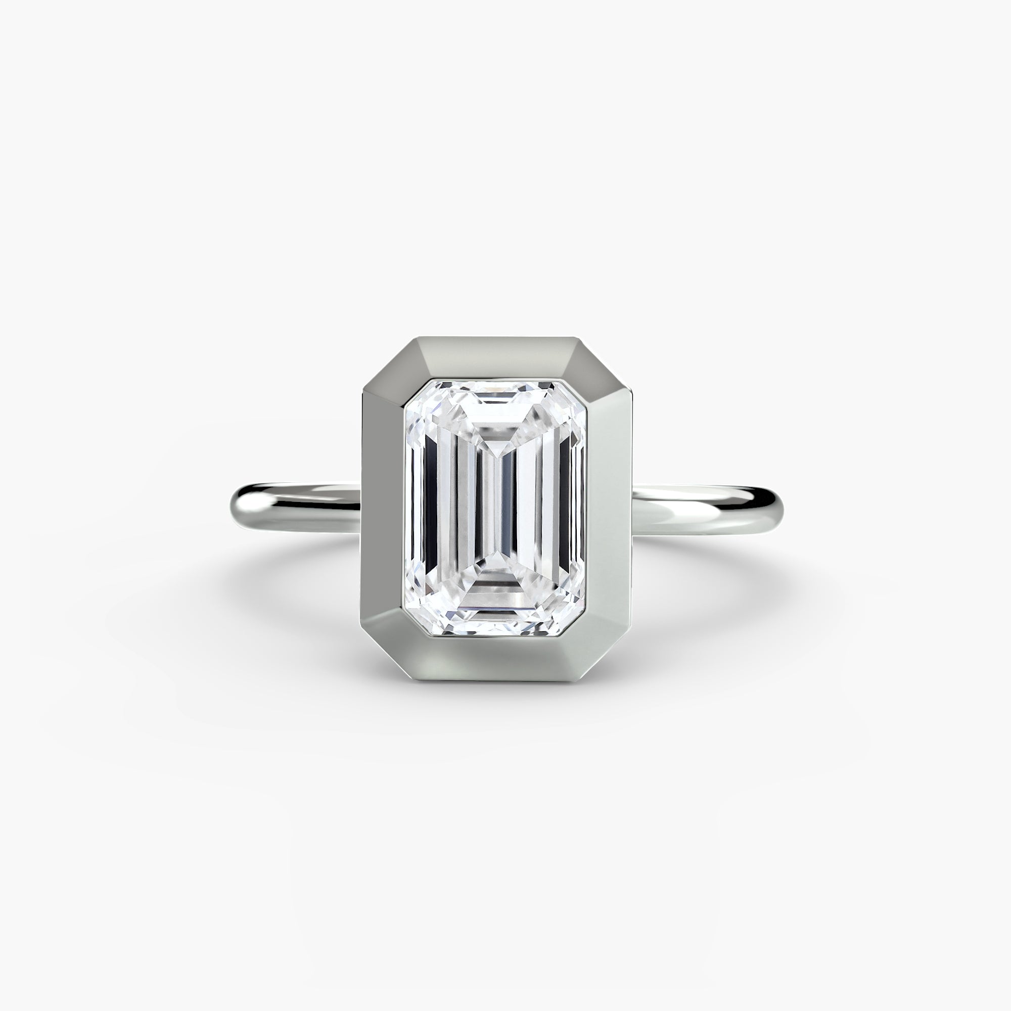 Jacob Mercari 14K White Gold Lab Grown Diamond Engagement Ring: Emerald cut Solitaire Diamond with a Bezel Setting.