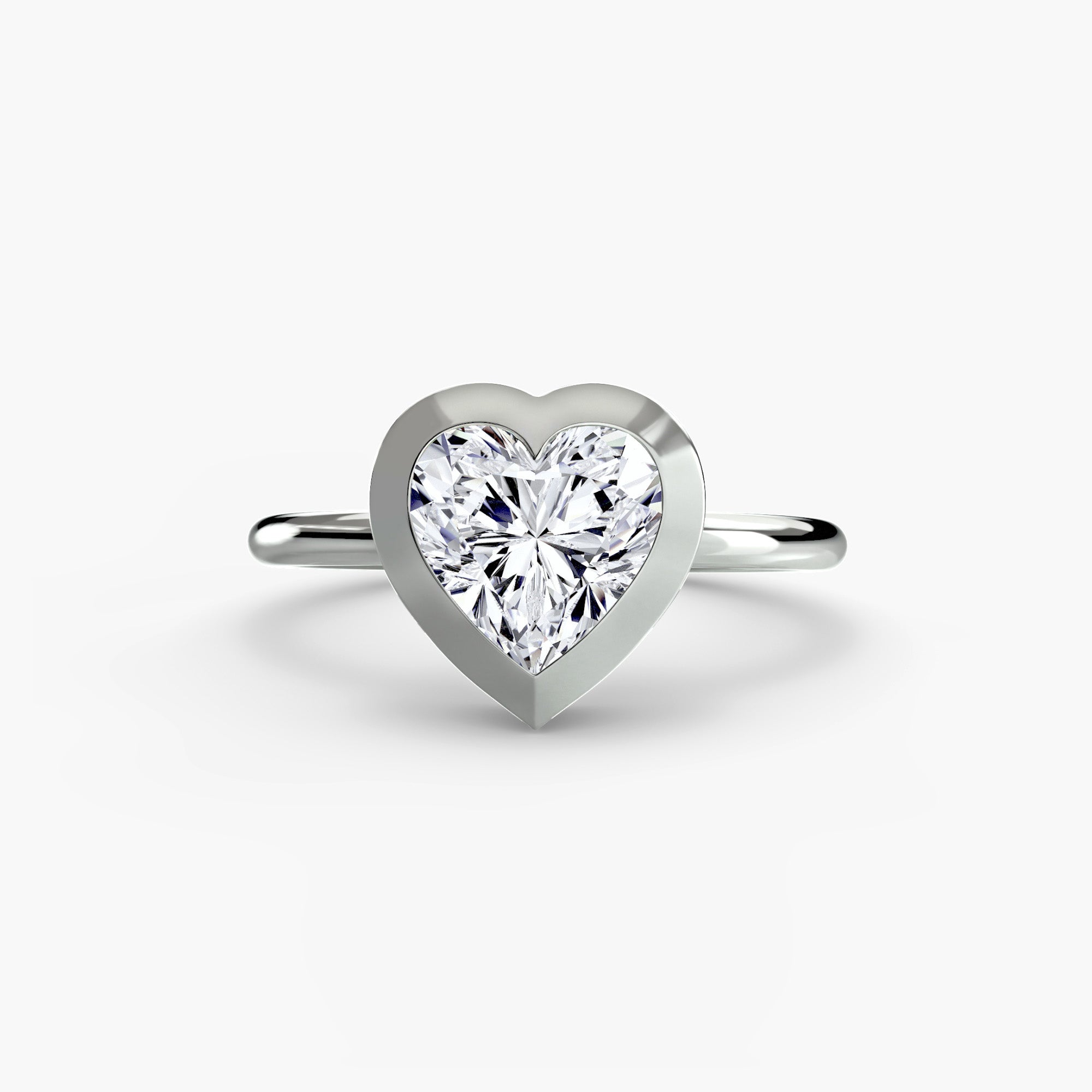 Jacob Mercari 14K White Gold Lab Grown Diamond Engagement Ring: Heart cut Solitaire Diamond with a Bezel Setting.