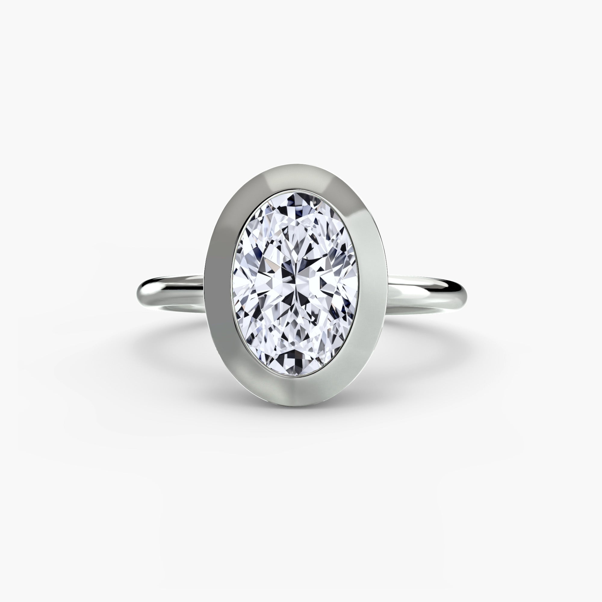 Jacob Mercari 14K White Gold Lab Grown Diamond Engagement Ring: Oval cut Solitaire Diamond with a Bezel Setting.