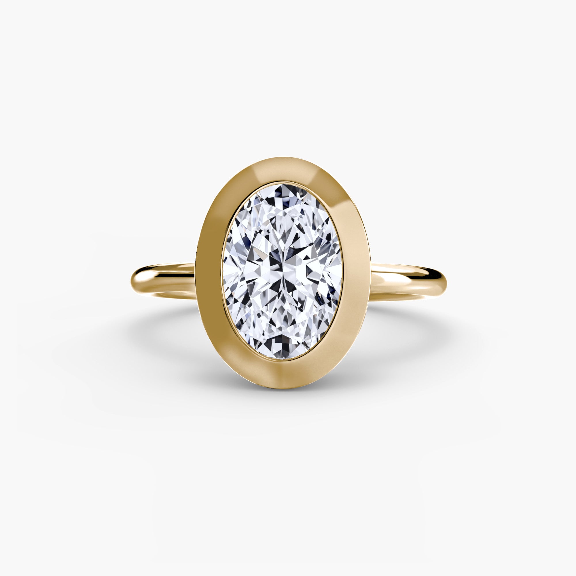 Jacob Mercari 14K Yellow Gold Lab Grown Diamond Engagement Ring: Oval cut Solitaire Diamond with a Bezel Setting.