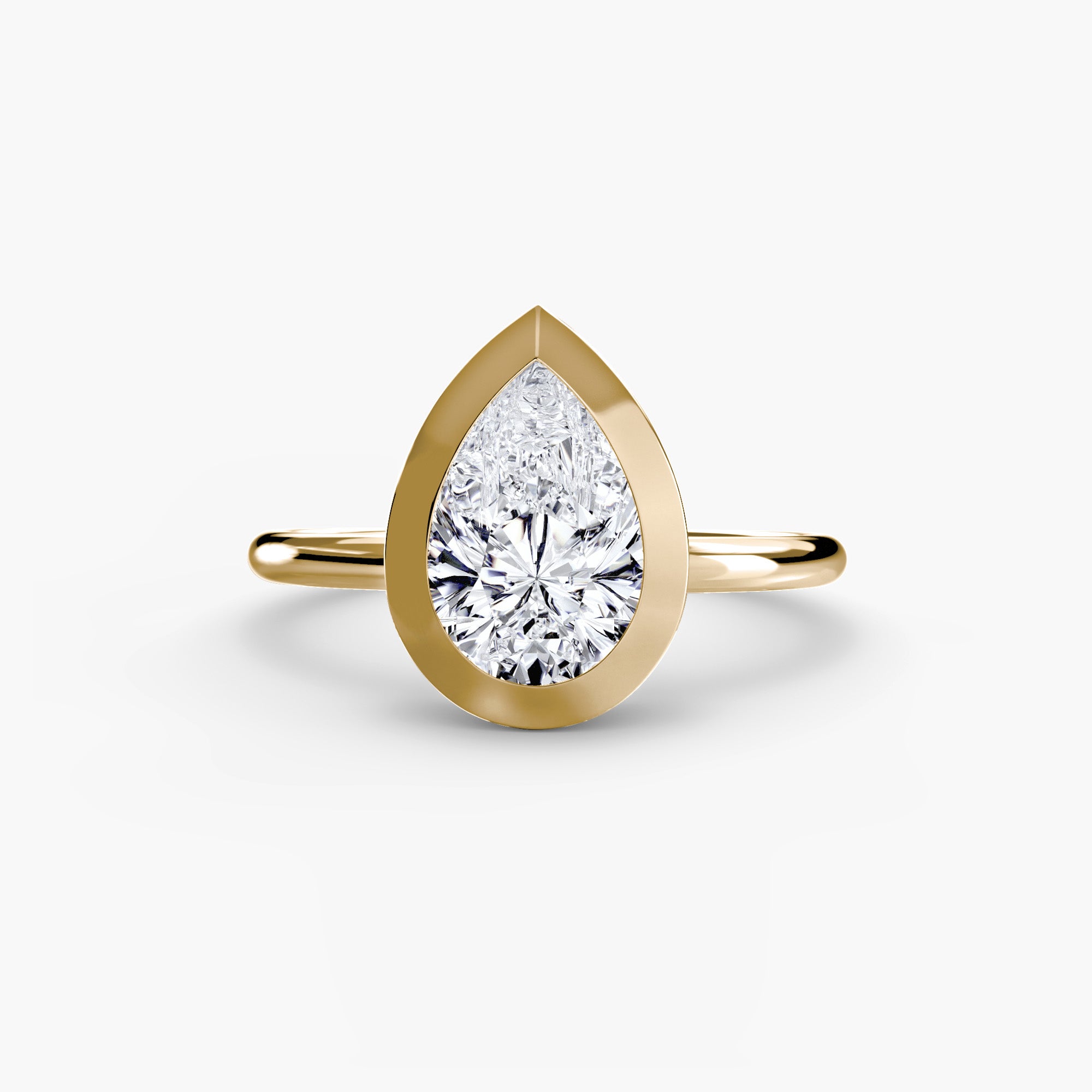 Jacob Mercari 14K Yellow Gold Lab Grown Diamond Engagement Ring: Pear cut Solitaire Diamond with a Bezel Setting.