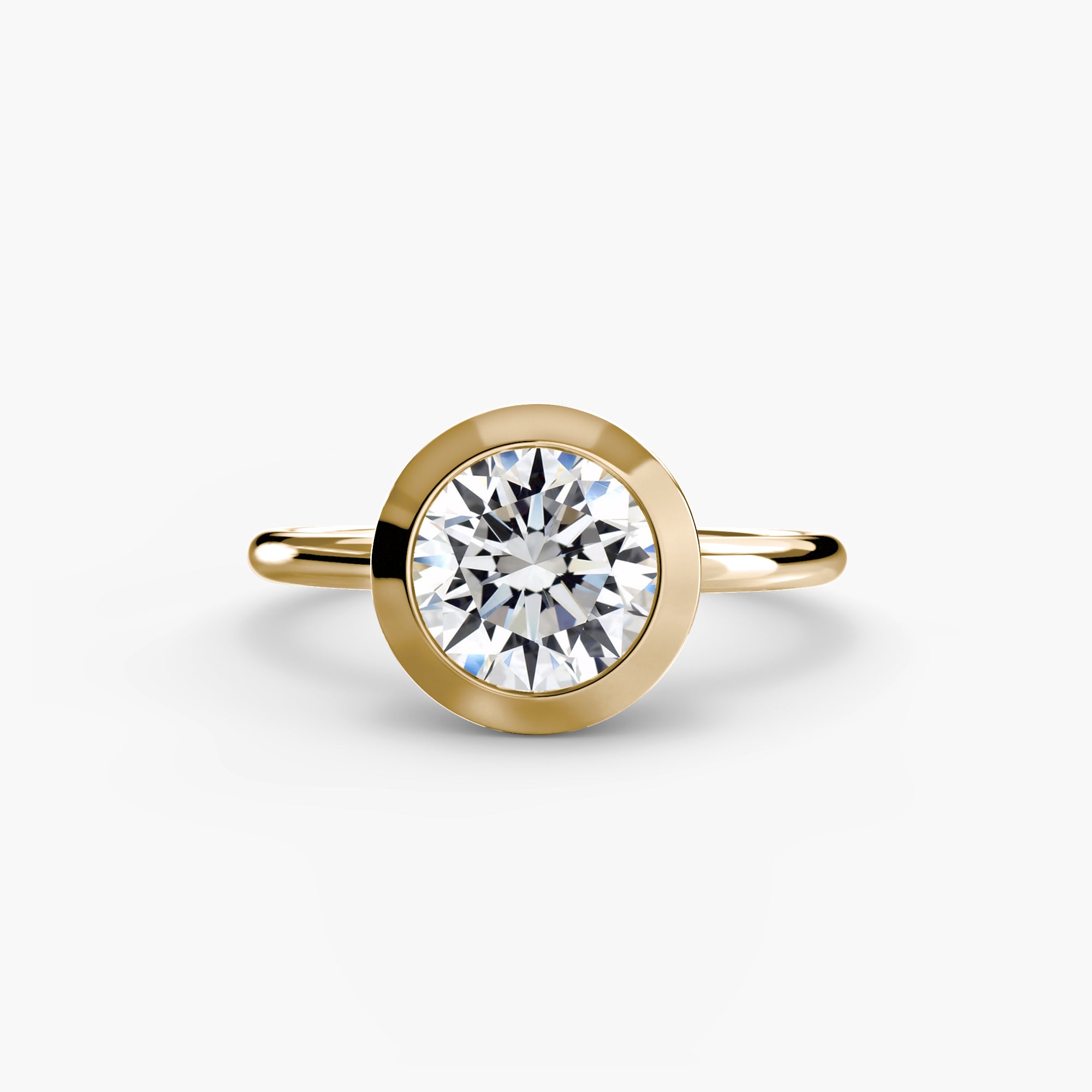 Jacob Mercari 14K Yellow Gold Lab Grown Diamond Engagement Ring: Round cut Solitaire Diamond with a Bezel Setting.