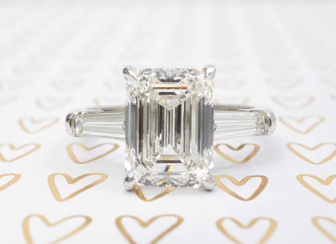 three stone emerald cut engagement ring