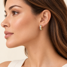 Close up of model wearing 14K White & Yellow Gold Hoop Earrings