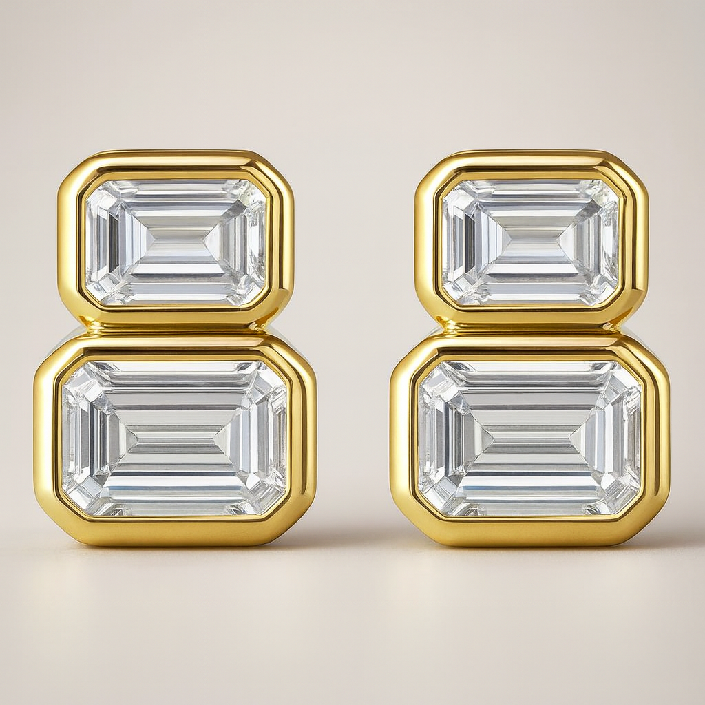 Gold earrings with emerald-cut diamonds on a beige background